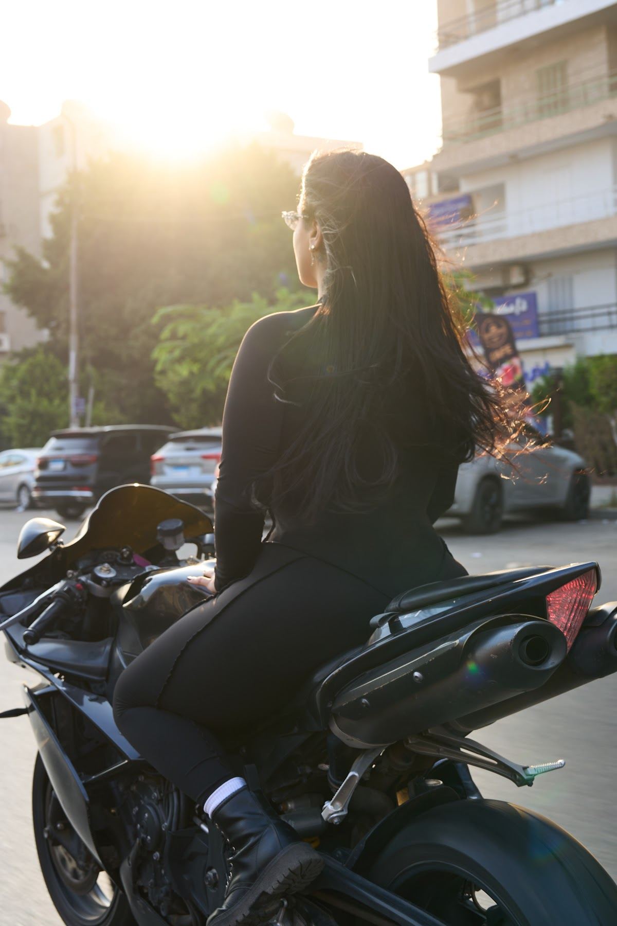 Black suit and motorbike in the city